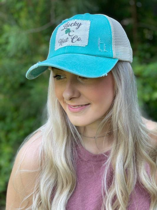 Lucky C Hat Co. clover logo, raggy patch, ladies ponytail hat